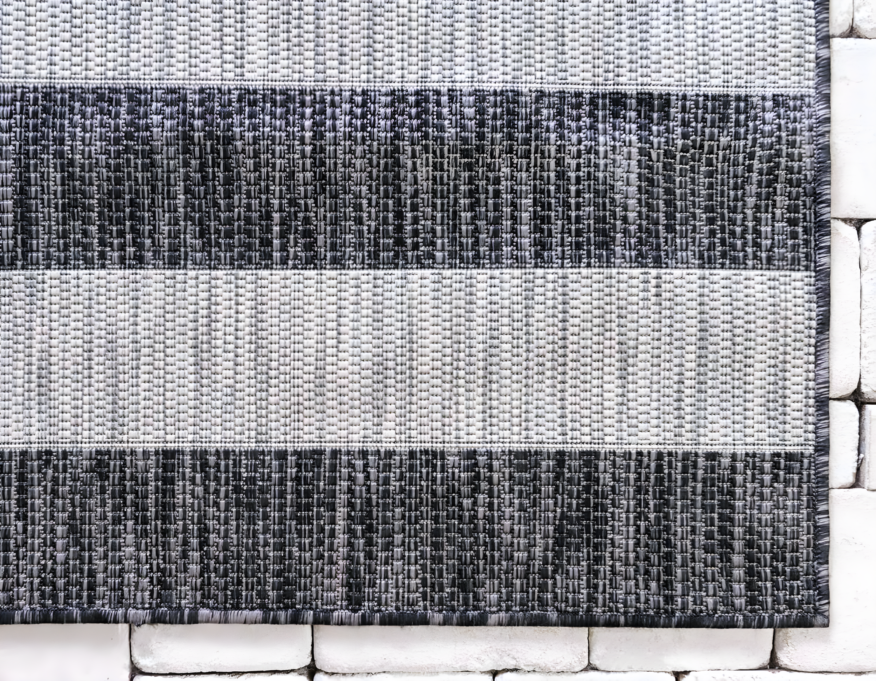 Charcoal Gray and Black Striped Synthetic Outdoor Rug 7' x 10'