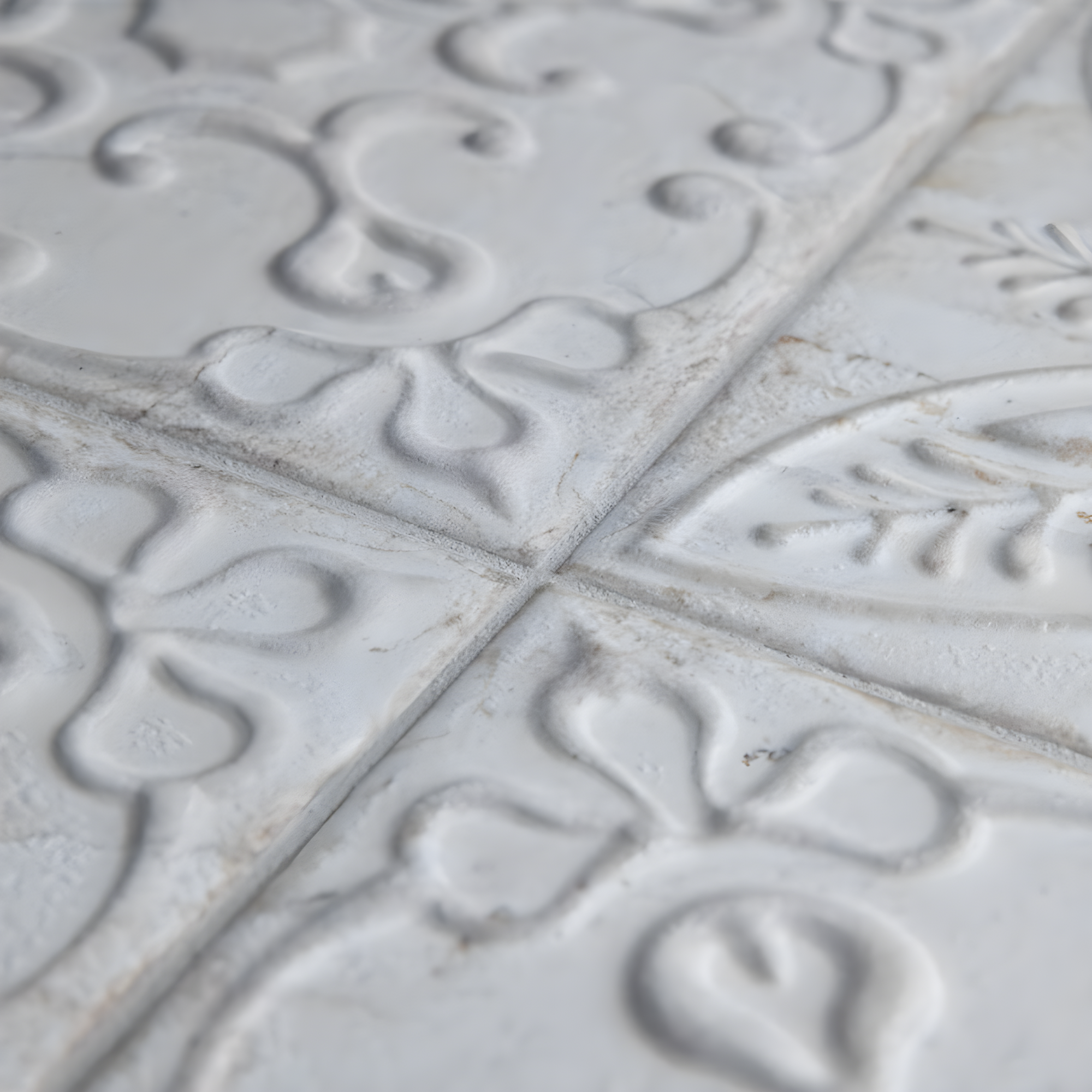 Aevum Ornato White Ceramic Wall Tile with Distressed Patterns