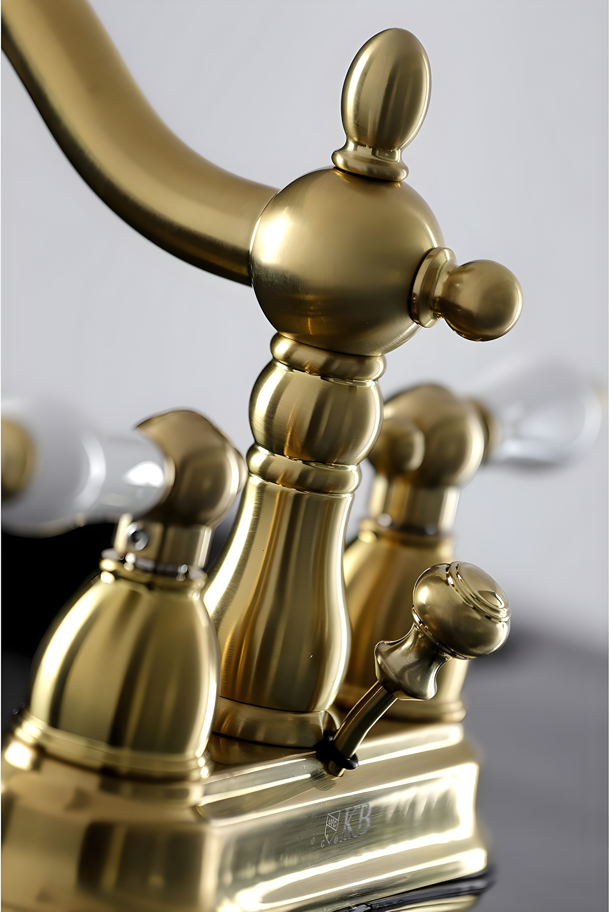 Kingston Brass Heritage Two-Handle 3-Hole Deck Mount 4" Centerset Bathroom Faucet with Plastic Pop-Up