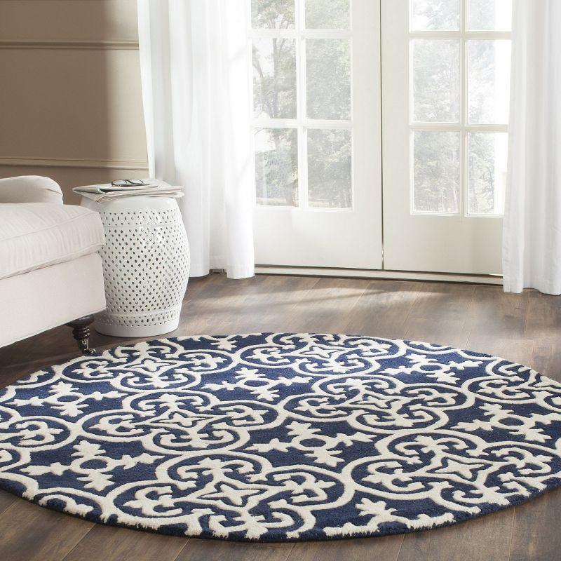 Handmade Round Blue and Ivory Wool Tufted Area Rug