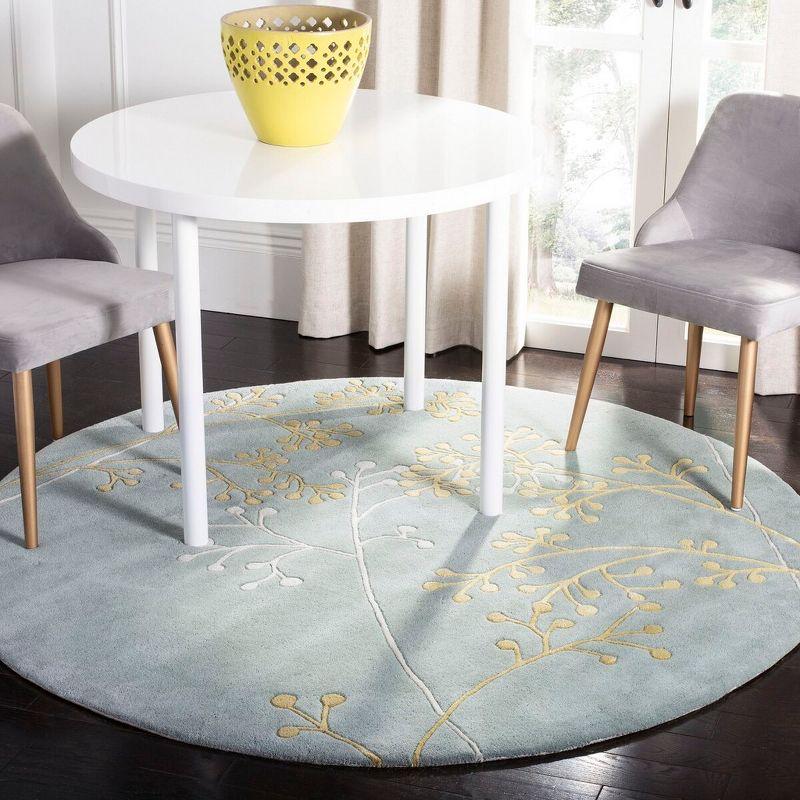 Soho SOH305 Hand Tufted Area Rug - Light Blue - 8' round - Safavieh.
