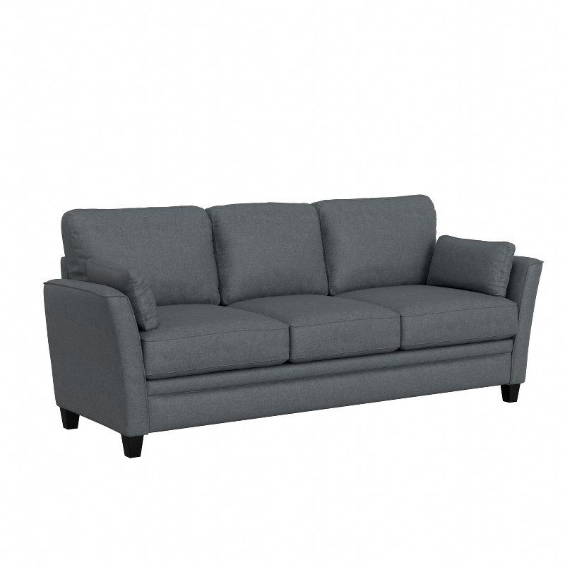 Gray Upholstered Sofa with Flared Arms and Pillows