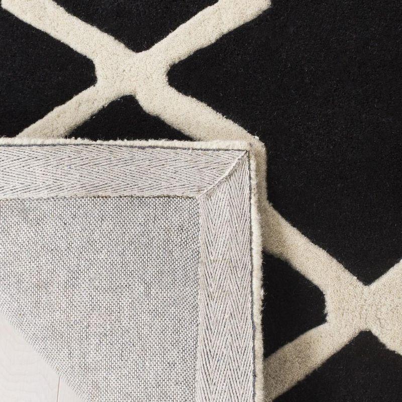 Black and Ivory Tufted Wool Geometric Area Rug 2' x 3'