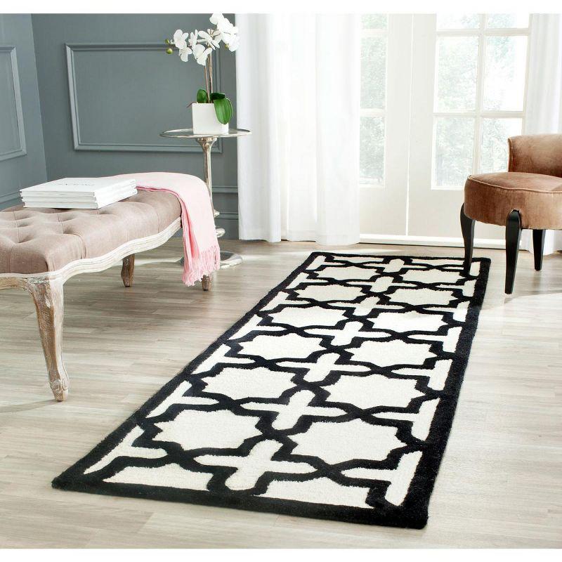 Hand-Tufted Black and Ivory Wool Area Rug, 2'6" x 4'