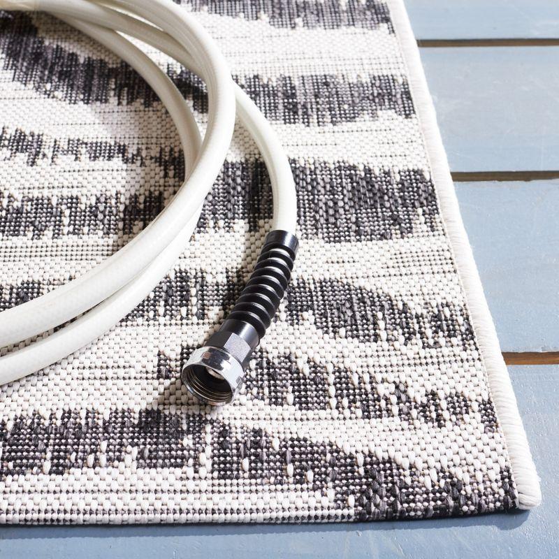 Ivory and Black Zebra Print Indoor/Outdoor Area Rug