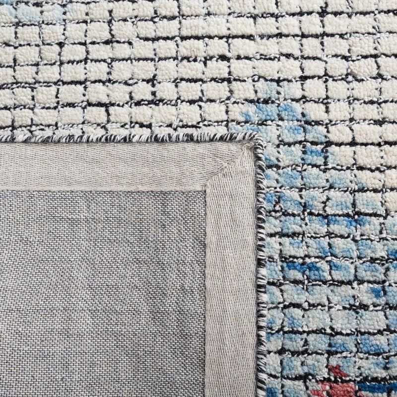 Ivory and Blue Abstract Handmade Wool 5' x 8' Area Rug