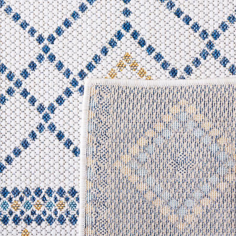 Ivory and Navy Geometric Synthetic Indoor/Outdoor Rug