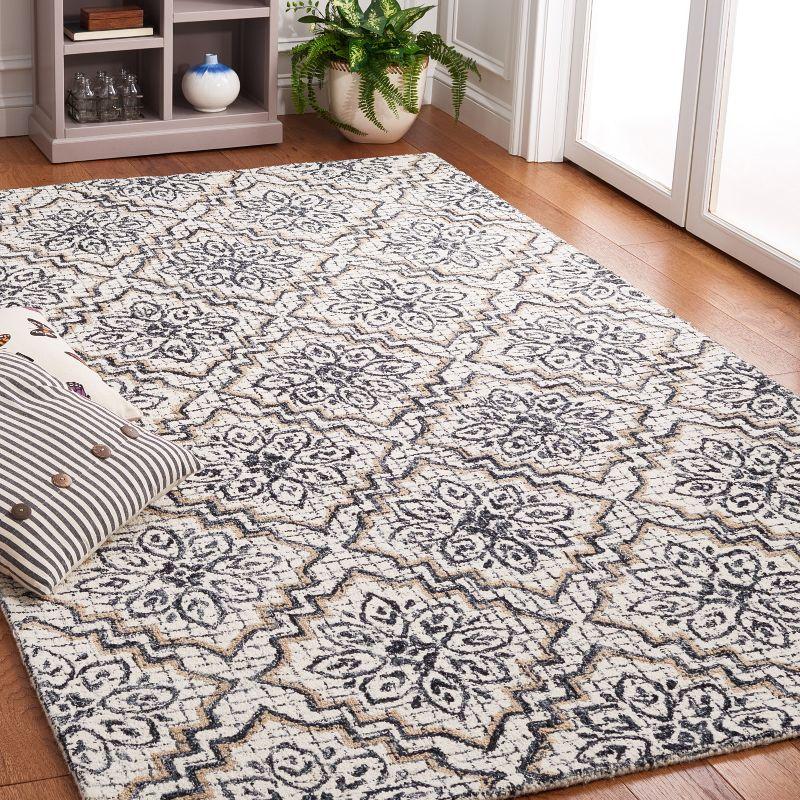 Ivory and Navy Tufted Wool Abstract Area Rug