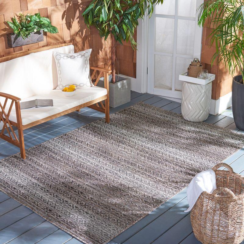 Ivory and Light Brown 8' x 10' Stain-Resistant Synthetic Area Rug