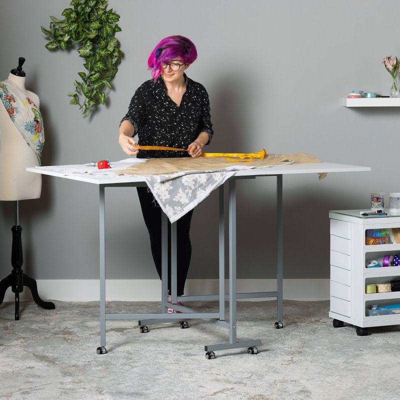 Sew Ready 58.75'' x 36.5'' Foldable Craft Table with Wheels