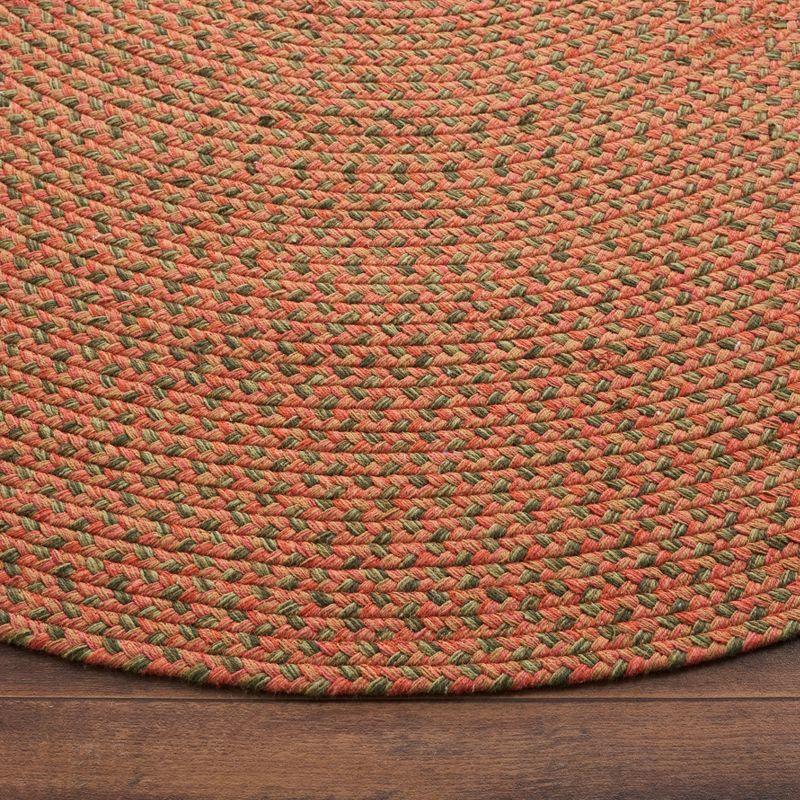 Handmade Orange Braided Cotton Oval Area Rug