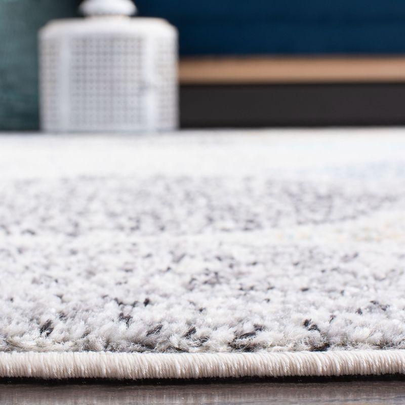 Ivory and Blue Square Synthetic Stain-Resistant Area Rug