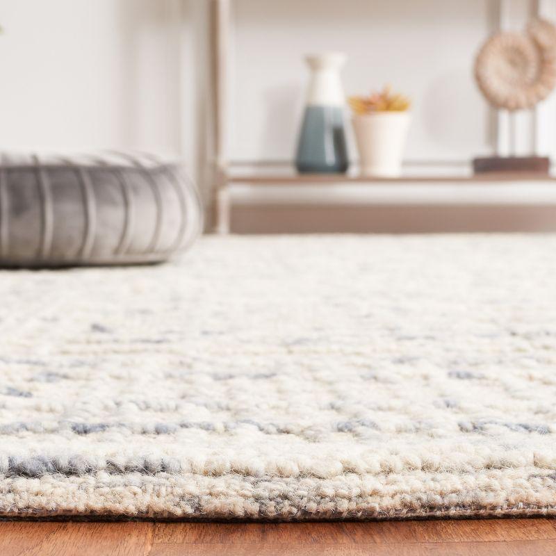 Abstract ABT275 Handmade Tufted Area Rug - Light Blue/Ivory - 5'-0" x 8'-0" - Safavieh