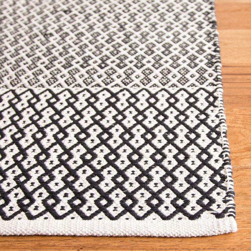 Coastal Charm Ivory & Black Handwoven Cotton Rug - 27" x 16"