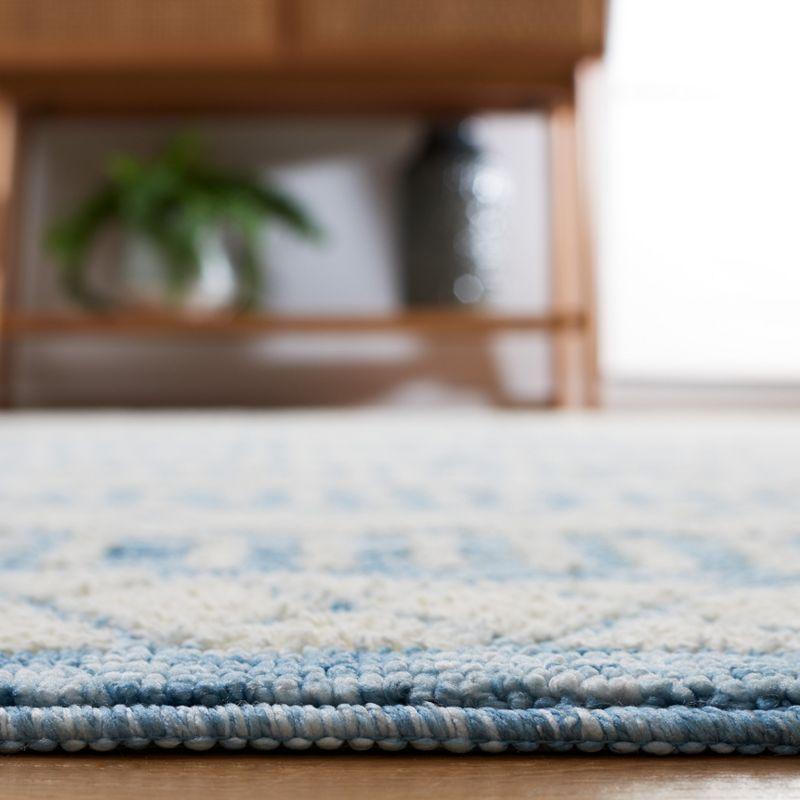 Ivory and Blue Washable Synthetic Area Rug, 3' x 5'