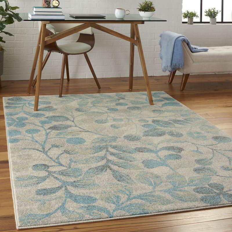 Ivory and Turquoise Floral Synthetic 4' x 6' Area Rug