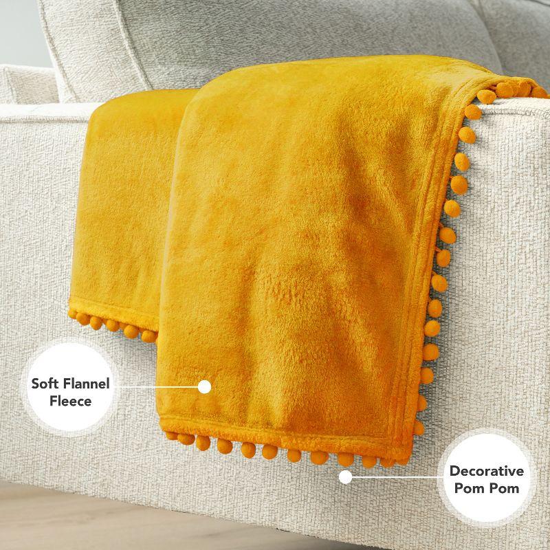 PAVILIA Fleece Pom Pom Blanket Throw for Sofa Bed, Soft Lightweight Pompom Fringe Blanket for Couch