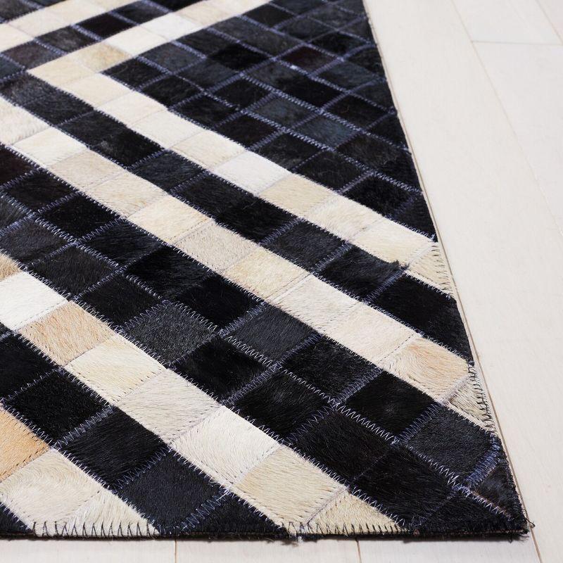 Handmade Black and Ivory Geometric Cowhide Area Rug