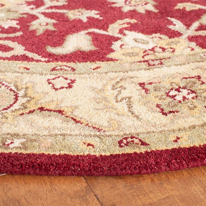 Antiquity AT312 Hand Tufted Area Rug - Red/Gold - 7'6"x9'6" Oval - Safavieh.