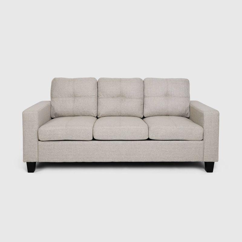 Beige Tufted Fabric Sofa with Natural Wood Legs and Sloped Arms