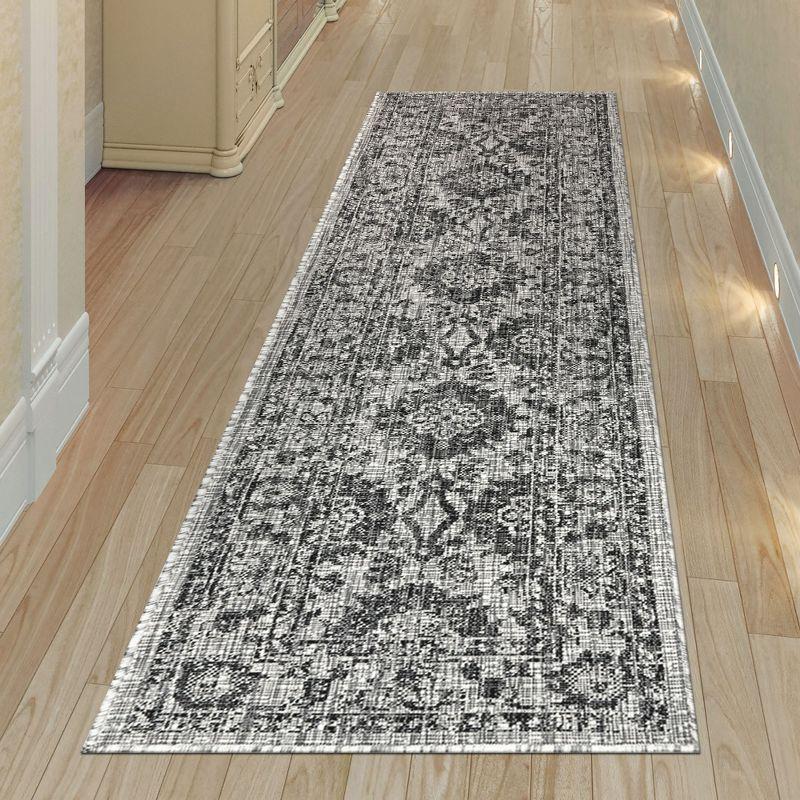 Carmel 24" Black Synthetic Flat Woven Floral Rug