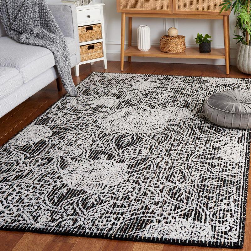 Ebony EBN114 Hand Tufted Area Rug - Black/Ivory - 6'x9' - Safavieh.