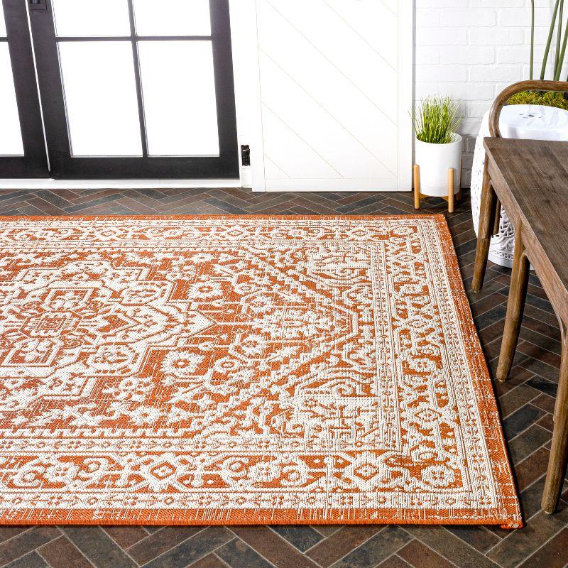 9' x 12' Sinjuri Medallion Textured Weave Indoor/Outdoor Area Rug, Orange/Cream - JONATHAN Y