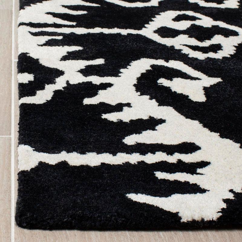 Handmade Black and Ivory Tufted Wool Area Rug