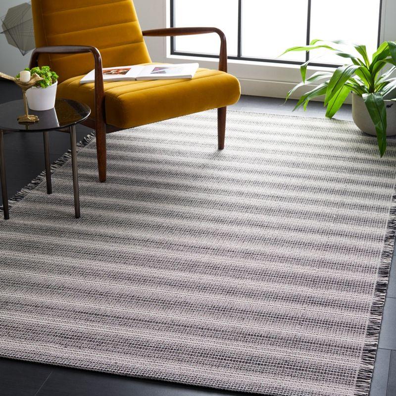 Ivory and Black Flat Woven 4' x 6' Synthetic Area Rug