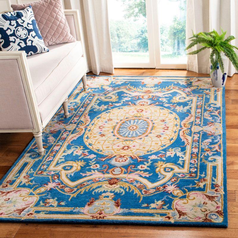 Handmade Blue and Ivory Floral Wool 8' x 10' Area Rug