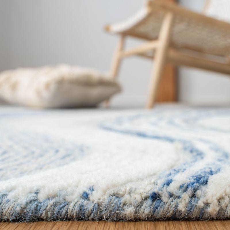 Round Blue and Ivory Tufted Wool Area Rug