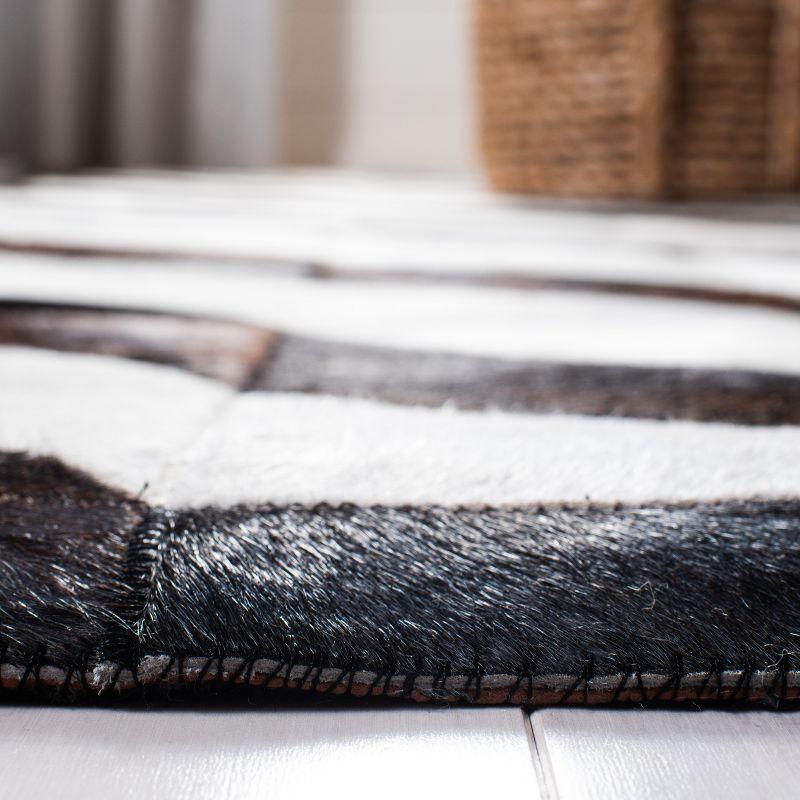 Handmade Black Geometric Cowhide Area Rug