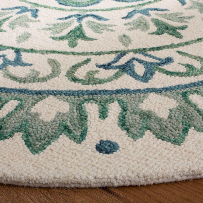 Novelty NOV607 Hand Tufted Area Rug - Ivory/Teal - 6' Round - Safavieh.