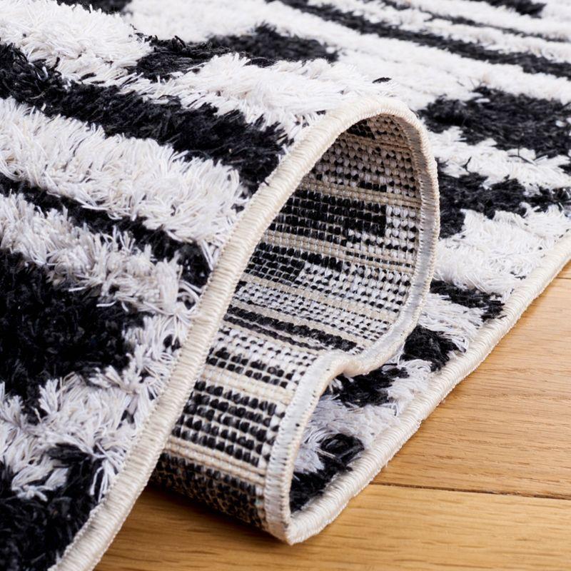 Nomadic Black/Ivory 5' x 7' Handmade Synthetic Area Rug