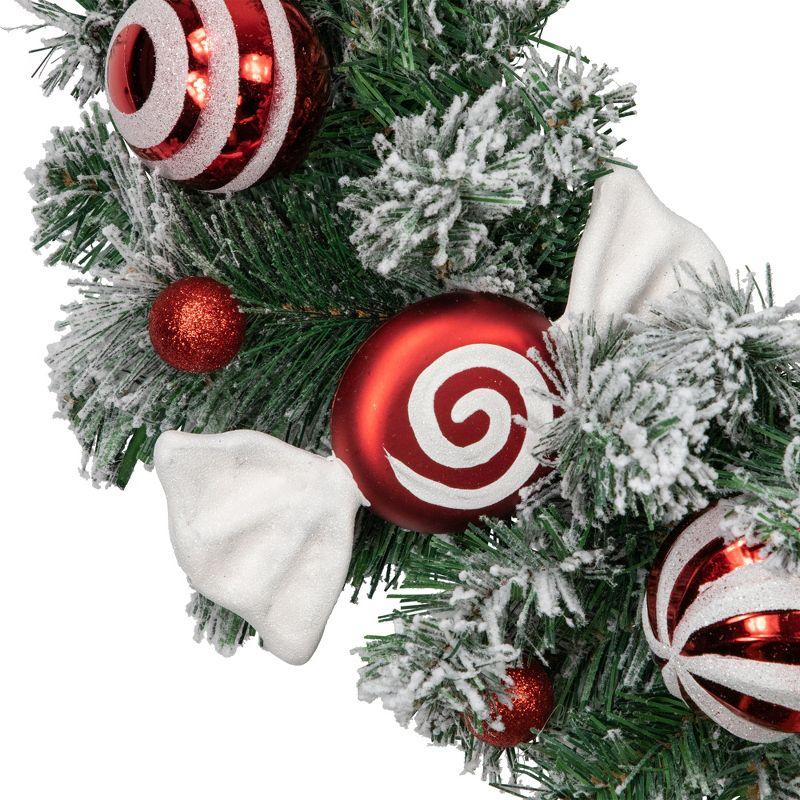 Frosted Pine Artificial Christmas Wreath with Swirled Candy Ornaments 24-Inch