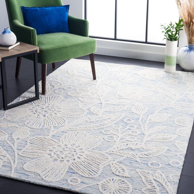 Handmade Floral Tufted Blue and Ivory Wool Area Rug 4' x 6'