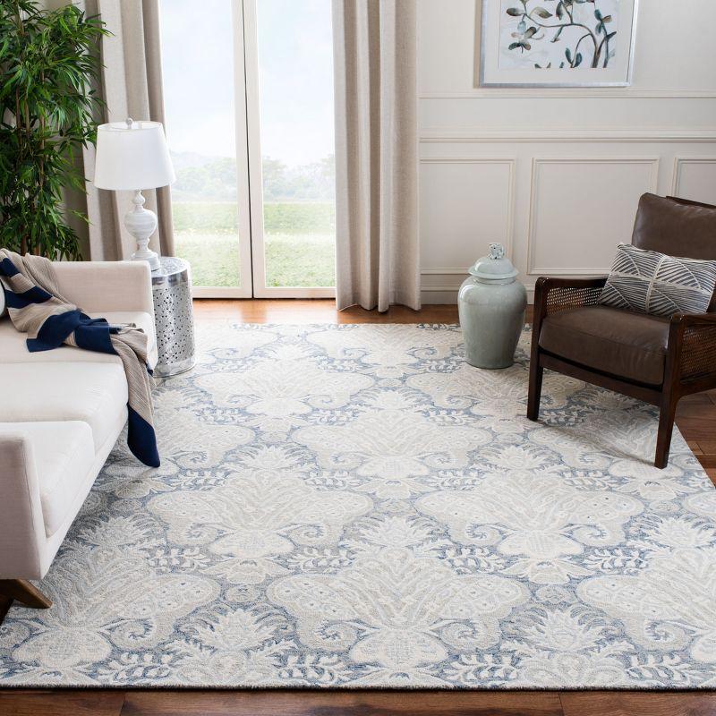 Blue and Ivory Hand-Tufted Wool Area Rug, 5' x 8'