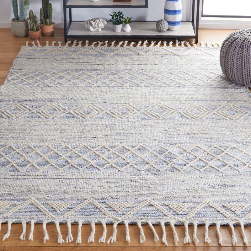 Ivory and Blue Handwoven Wool Area Rug with Fringe