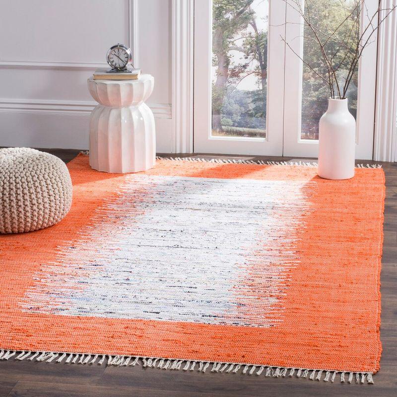 Ivory and Orange Cotton Flat Woven 6' x 9' Area Rug