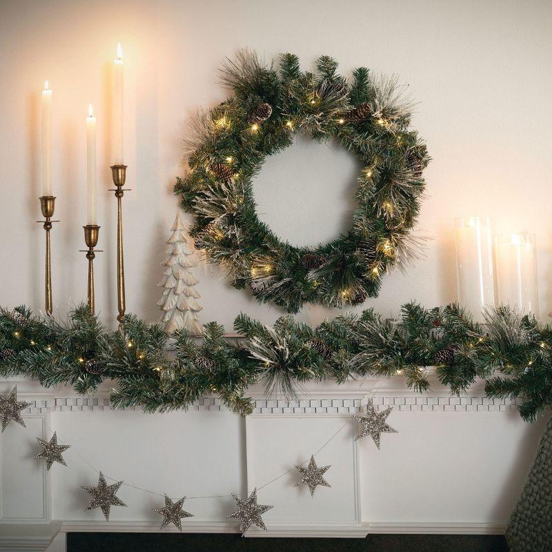 Sullivans 9-Foot Pre-lit Artificial Mixed Pine Christmas Garland Decorated with Pinecones, Light Flocking, Gold Glittered Accents, and Warm White