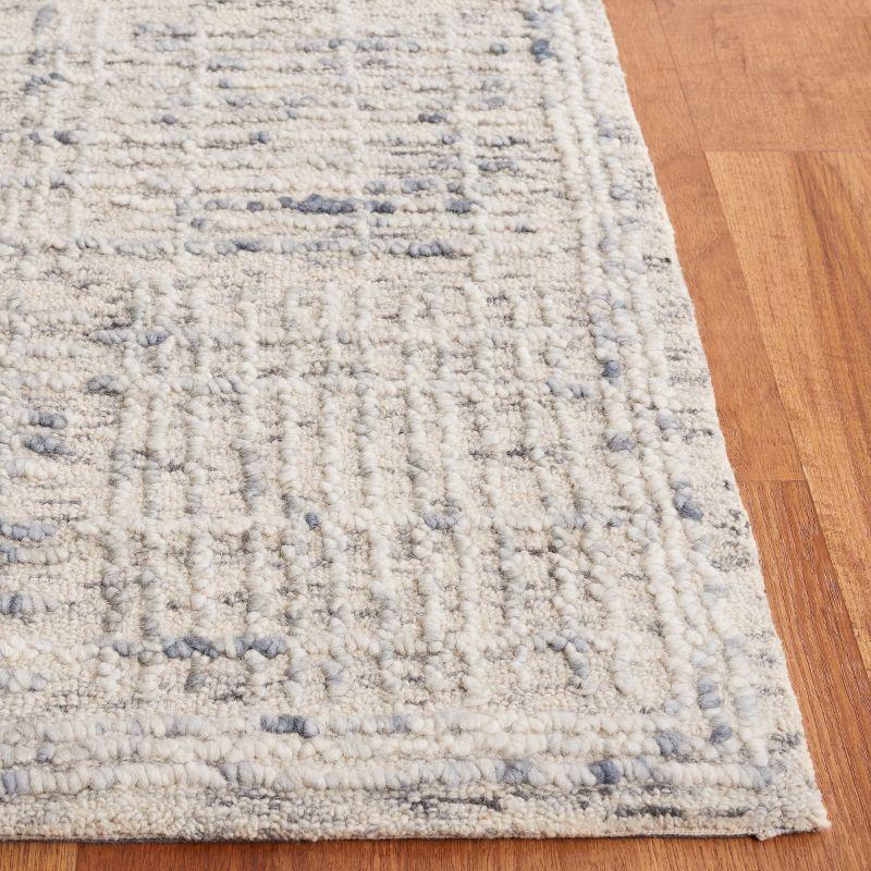 Handmade Light Blue and Ivory Abstract Wool Tufted Rug