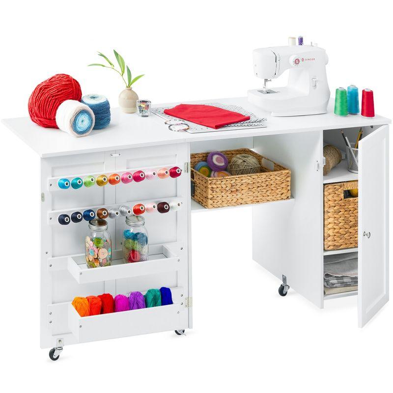 Compact White Folding Sewing and Craft Table with Storage and Caster Wheels