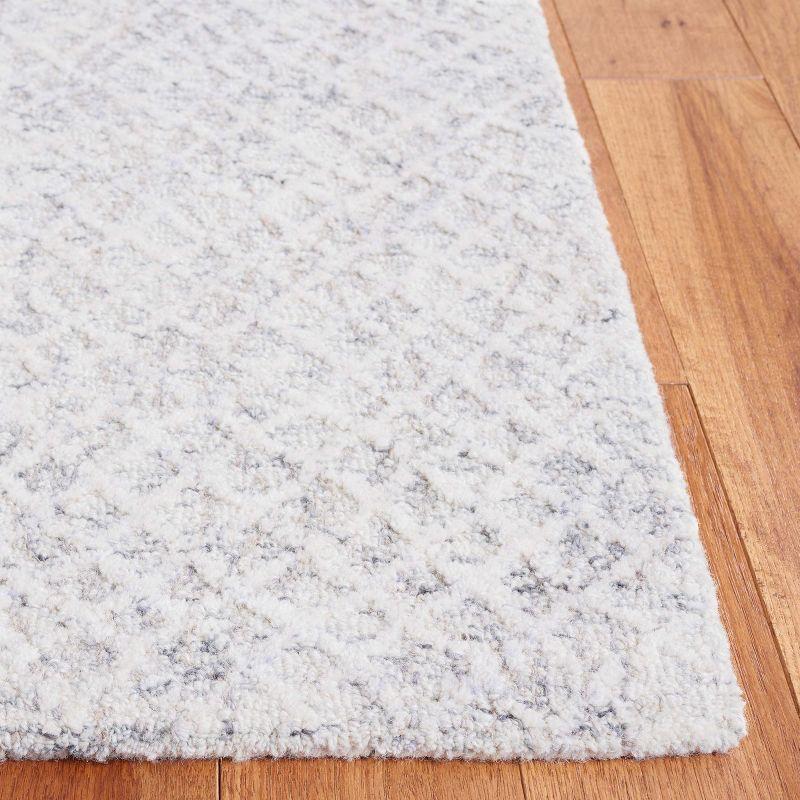 Gray and Ivory Tufted Wool 4' x 6' Area Rug