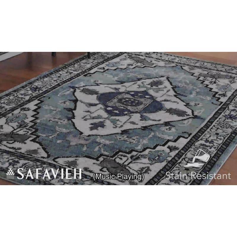 Blue and Ivory Synthetic Persian Area Rug, 5'3" x 7'6"