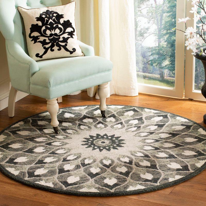 Novelty NOV603 Hand Tufted Area Rug - Charcoal/Ivory - 9' round - Safavieh.