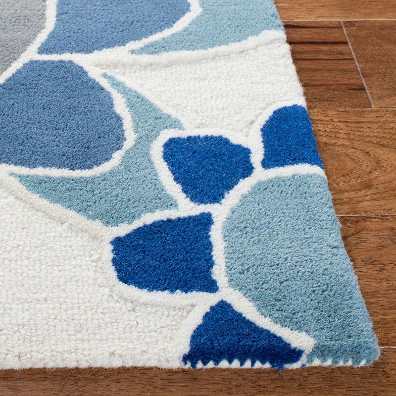 Safavieh Kids SFK923 Hand Tufted Area Rug - Ivory/Blue - 3'x5' - Safavieh.