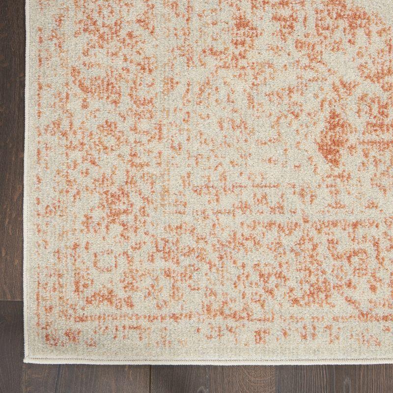 Ivory and Pink 5'3" x 7'3" Synthetic Rectangular Area Rug