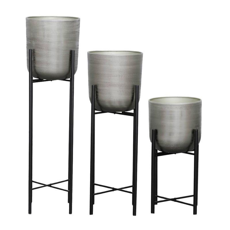 Elegant Trio of Silver Distressed Metal Planters on Stands