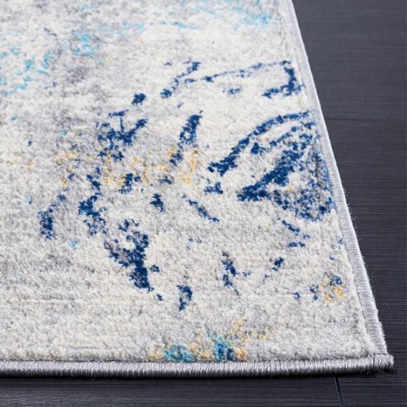 Ivory Abstract Synthetic 8' x 10' Easy-Care Area Rug