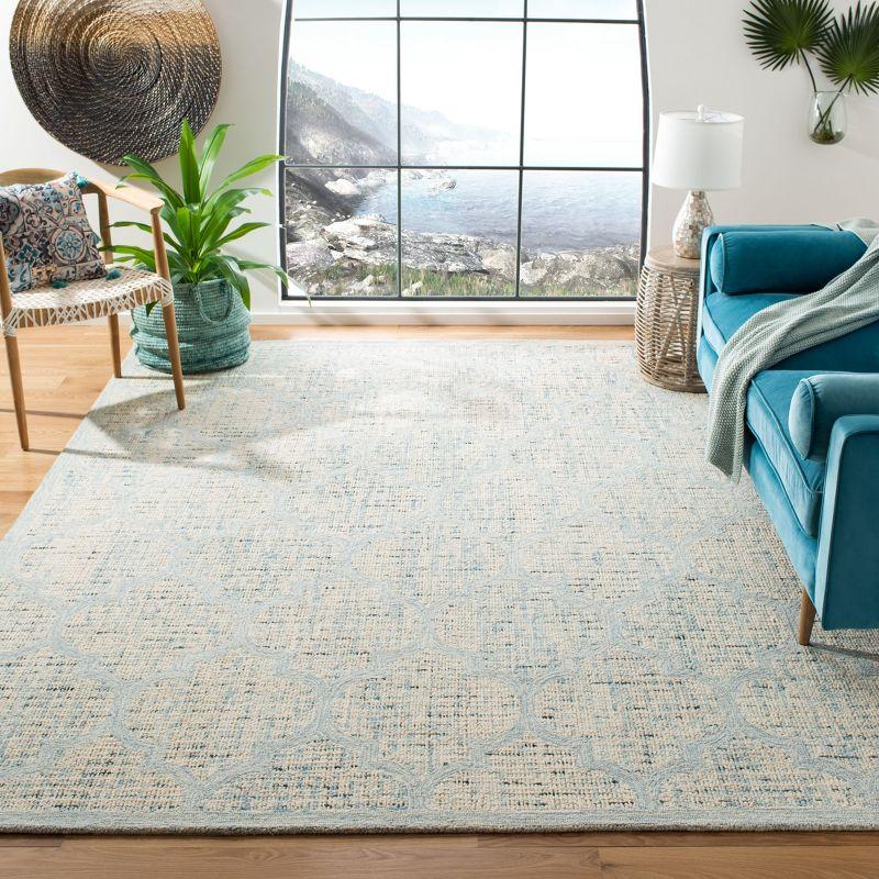 Ivory and Turquoise Handmade Tufted Wool Area Rug, 8' x 10'